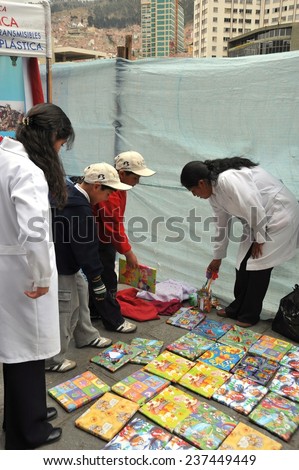 LA PAZ, BOLIVIA - SEPTEMBER 5, 2010: The actual capital of Bolivia, where most of the state institutions are. Students of medical faculty give classes to people on the street on healthy life style.