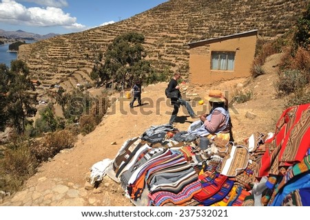 ISLAND OF THE SUN, BOLIVIA - SEPTEMBER 4, 2010:  Sun island is located on lake Titicaca. The Indians named it in honor of the Sun God Inti. Locals from the island of the Sun.