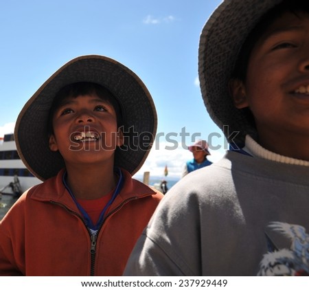 ISLAND OF THE SUN, BOLIVIA - SEPTEMBER 4, 2010: Sun island is located on lake Titicaca. The Indians named it in honor of the Sun God Inti. Unknown boys on the island of the Sun.