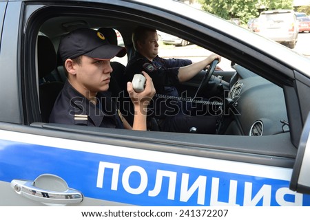 MOSCOW, RUSSIA - AUGUST 8, 2013:  Police in the patrol car. Patrol and inspection service of the police provides public safety in the capital.