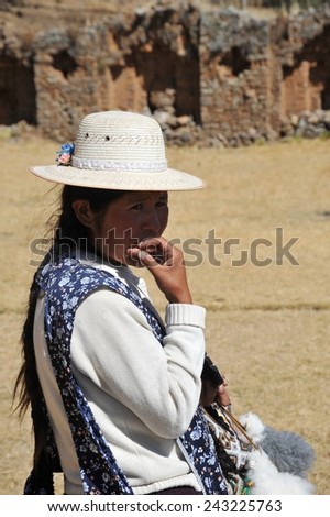 ISLAND OF THE MOON, BOLIVIA - SEPTEMBER 4, 2010 : Island  of the Moon is located on lake Titicaca. At the time of the Incas lived here in seclusion young women. Unknown woman on the island of the Moon