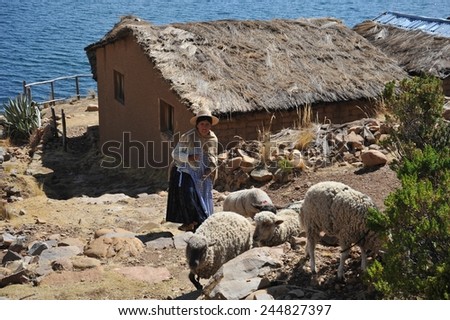 ISLAND OF THE MOON, BOLIVIA - SEPTEMBER 4, 2010 : Island of the Moon is located on lake Titicaca. Incas live here in seclusion. Unknown woman on the island of the Moon