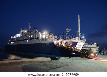 PORT CRIMEA, KERCH, RUSSIA - SEPTEMBER 15, 2014: Unloading vehicles on the ferry in the port of Crimea. Train ferry between port Crimea, Kerch, and port Caucasus
