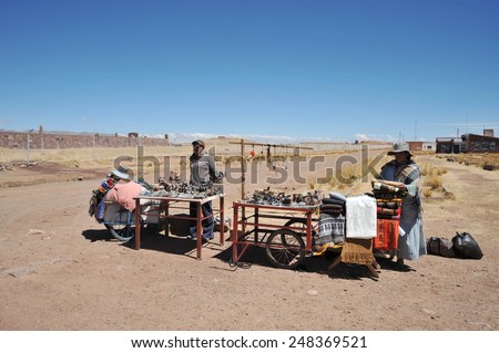 TIAHUANACO, BOLIVIA - SEPTEMBER 3, 2010: Trade of Souvenirs on the cultural and historical object Tiahuanaco. Tiahuanaco, an important object of  archaeological site on the  Altiplano plateau.