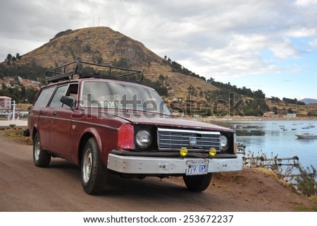 COPACABANA, BOLIVIA - SEPTEMBER 4, 2010:  The car on the shores of lake Titicaca in the town of Copacabana. Titicaca, the highest largest fresh water lake in South America.