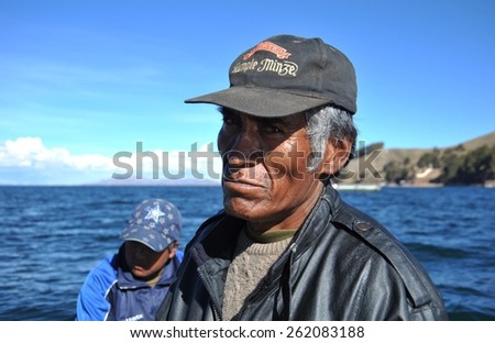 TITICACA LAKE, BOLIVIA - SEPTEMBER 4, 2010: The ferryman. Ferry service on lake Titicaca. Titicaca, the highest largest fresh water lake in South America , the highest navigable lake in the world.