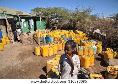 HARGEISA, SOMALIA - JANUARY 11, 2010: One of the largest refugee camps for African refugees and displaced people on the outskirts of Hargeisa under auspices of UN. Point of delivery of drinking water.