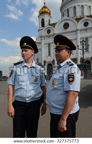 MOSCOW, RUSSIA - AUGUST 13, 2013:Employees of patrol police control the territory at the Cathedral of Christ the Savior.