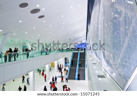 BEIJING - JULY 2008: People walk inside the National Aquatics Center in Beijing. The center, also known as the Water Cube, was built for the upcoming Beijing 2008 Olympic Games.