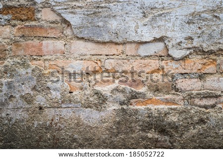 grunge cracked wall revealed old bricks inside