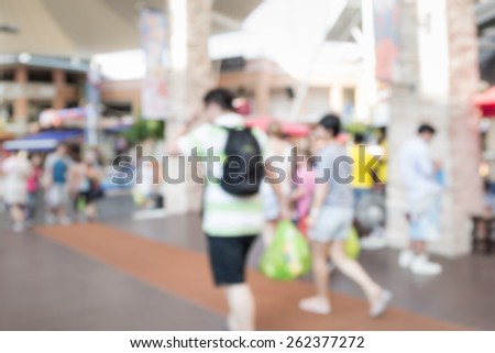 Abstract of blurred people walking in the market