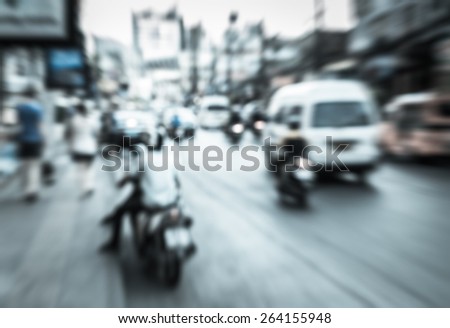 Abstract od blurred vehicle and motorcycle moving on the road in town