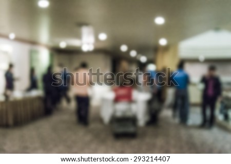 Abstract of blurred people preparing ballroom for banquet in the hotel
