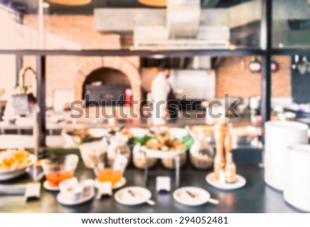 Abstract of blurred western kitchen with food preparing