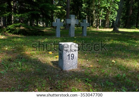Toila, Estonia - July 09,  2011: The old German cemetery on the outskirts of the park Toila-Oru, crosses in the shadow of foliage