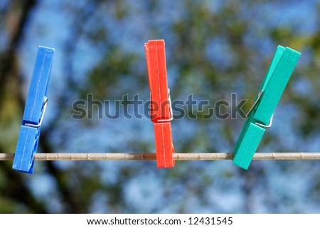 colorful plastic clothes pins on an outdoor laundry line