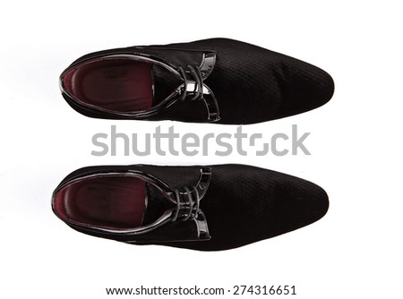 Black patent leather men shoes against white background