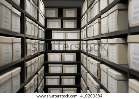Archive evidence police depository cardboard box black shelves with white office boxes card file