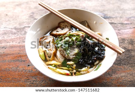 Thai Noodle Soup with fish and herbal