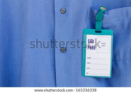 Blank name leather badge on blue shirt background