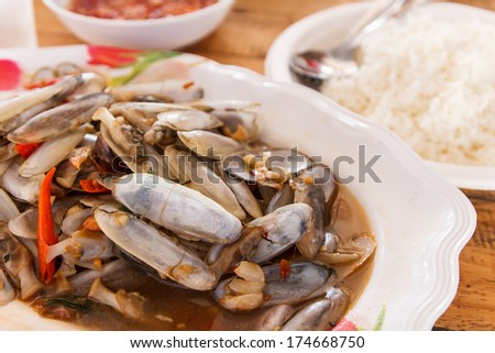 Fried sea bean clams with salted on plate and rice