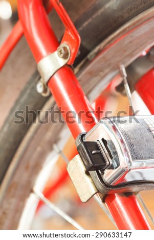 Security lock blocking the bicycle wheel in park
