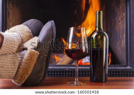 drinks at cozy fireplace on winters evening
