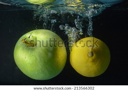 Fruits drop into water