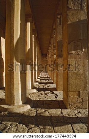 Columns and shadows at the Mortuary Temple of Queen Hatshepsut, Valley of the Gods, Deir Al-Bahri, West Bank, Luxor