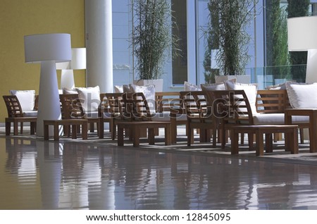 Hotel lobby filled with brown furniture
