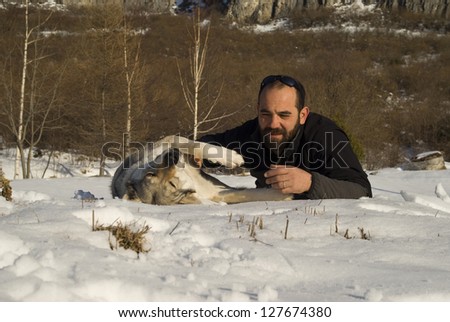 Man and his Czechoslovakian wolf dog