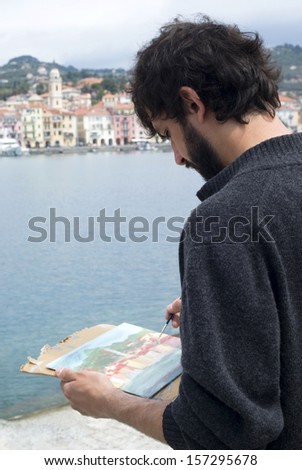 Artist painting a picture, outdoors