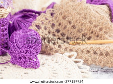 Yarn for crochet and knitted openwork napkins, still life photo with tools for handmade.