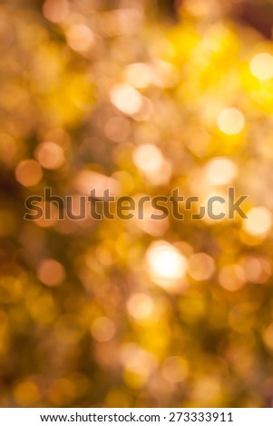 Bokeh Nature background.  abstract orange background from tree. Defocused lights from tree and leaves. Vertical image