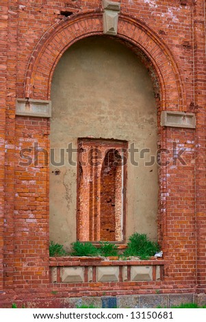 Windows and arches from red bricks and concrete