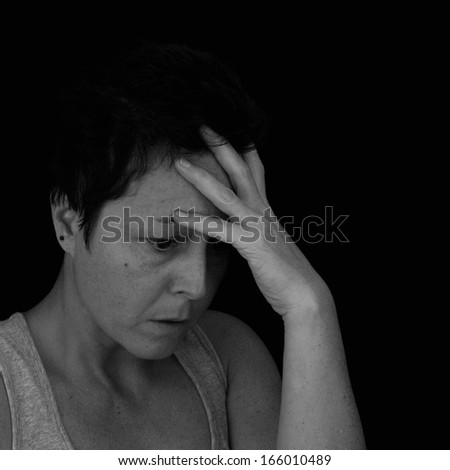 Depressed woman. Isolated black and white image.
