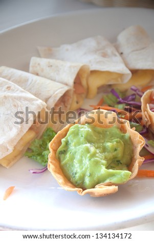 Guacamole sauce with quesadillas at lunch time in Mexico