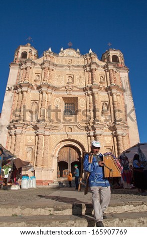 SANTO DOMINGO CHURCH, SAN CRISTOBAL DE LAS CASAS, MEXICO - FEBRUARY 8, 2013: It is one of the  major landmarks of the city with its open air crafts market.  Its facade is richly ornamented