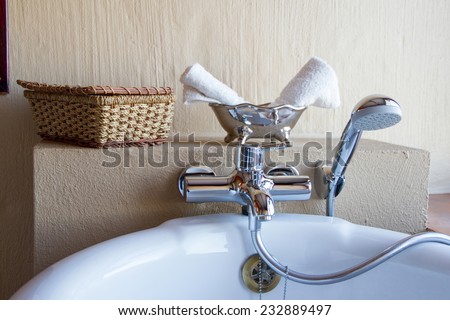Luxury bath tub in a bathroom with towels