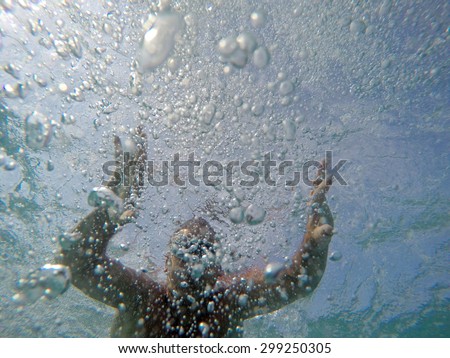 Swimming under the water in a clear sea
