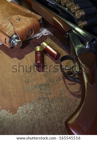 hunting rifle and bullets on the table