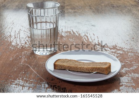 stale bread and a glass of water