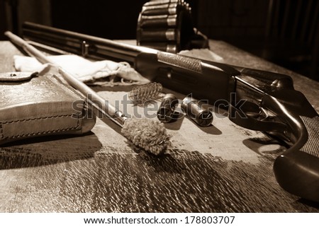 hunting rifle and bullets on the table