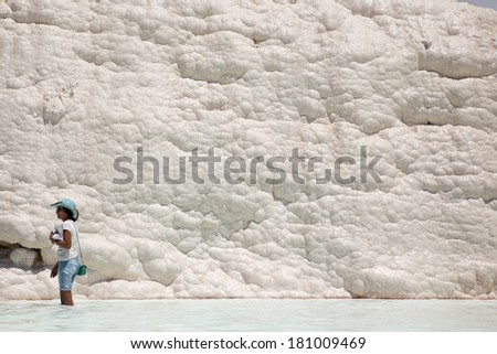 PAMUKKALE, TURKEY - MAY, 31: Tourist on Pamukkale on May 31, 2013 in Pamukkale, Turkey. Pamukkale, UNESCO world heritage site, nowadays become one of the most visited sight in Turkey