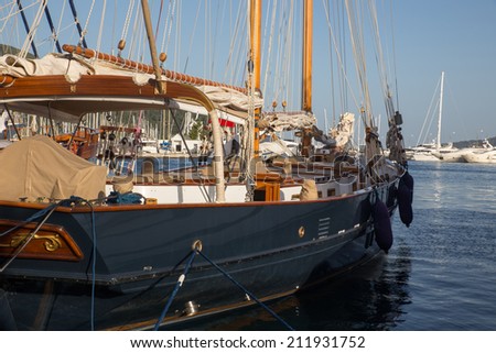 Sailboat harbor, many beautiful moored sail yachts in the sea port, modern water transport, summertime vacation, luxury lifestyle and wealth concept