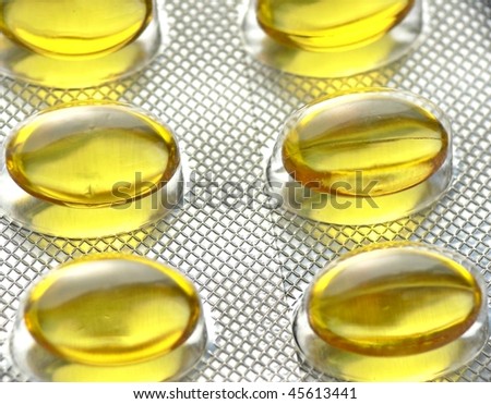 Yellow pills close-up