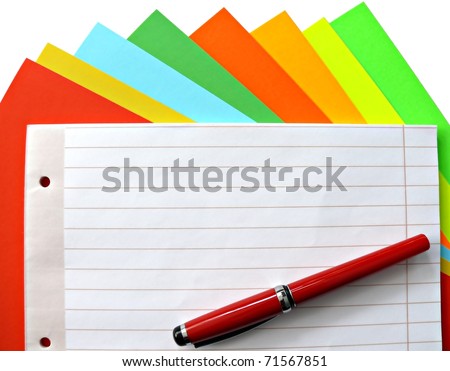 Copybook and pen on colorful papers