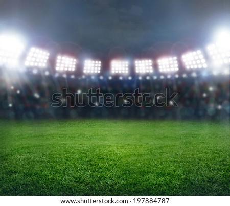 Green soccer stadium, illuminated field, arena in night