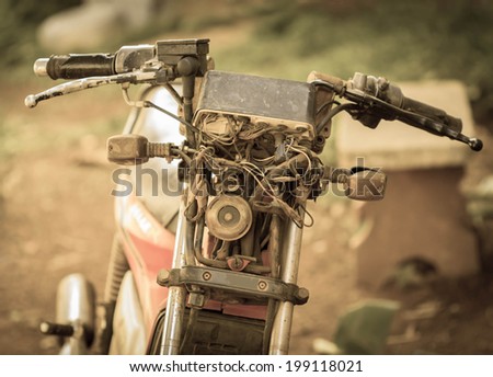 Old rusty motorcycle,Vintage background.