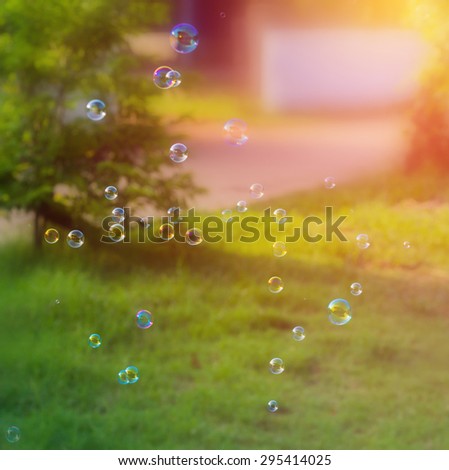 Rainbow bubbles from the bubble blower,vintage background.